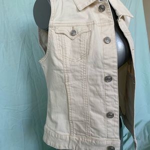 Cream colored jean sleeveless jacket